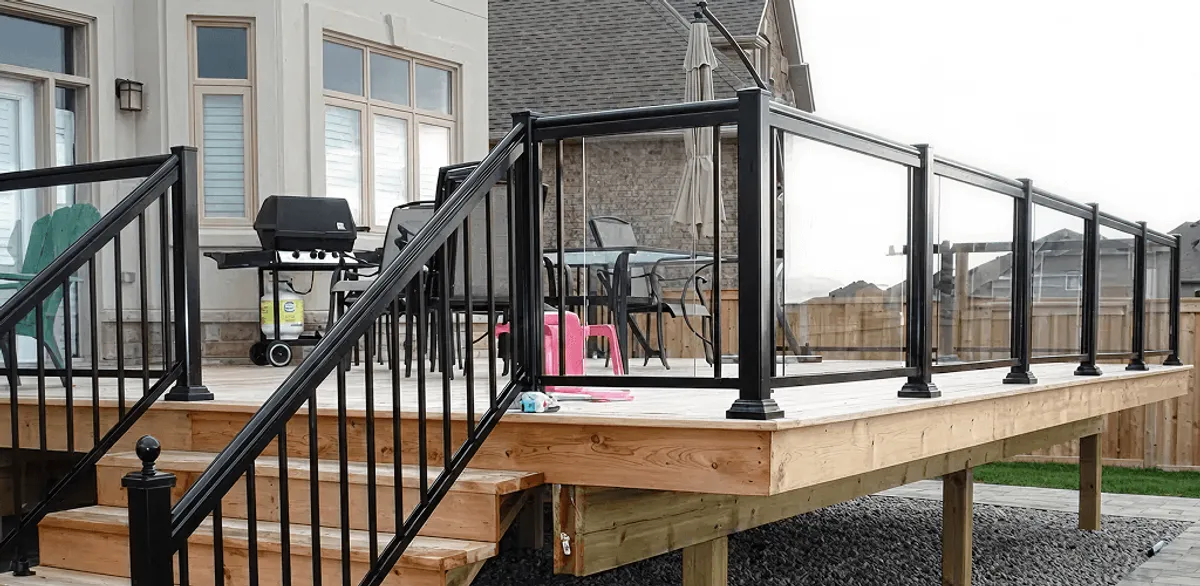 Handrail installation on a deck staircase for safety and code compliance in Louisville, KY
